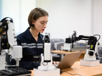 Lab technician working a laptop